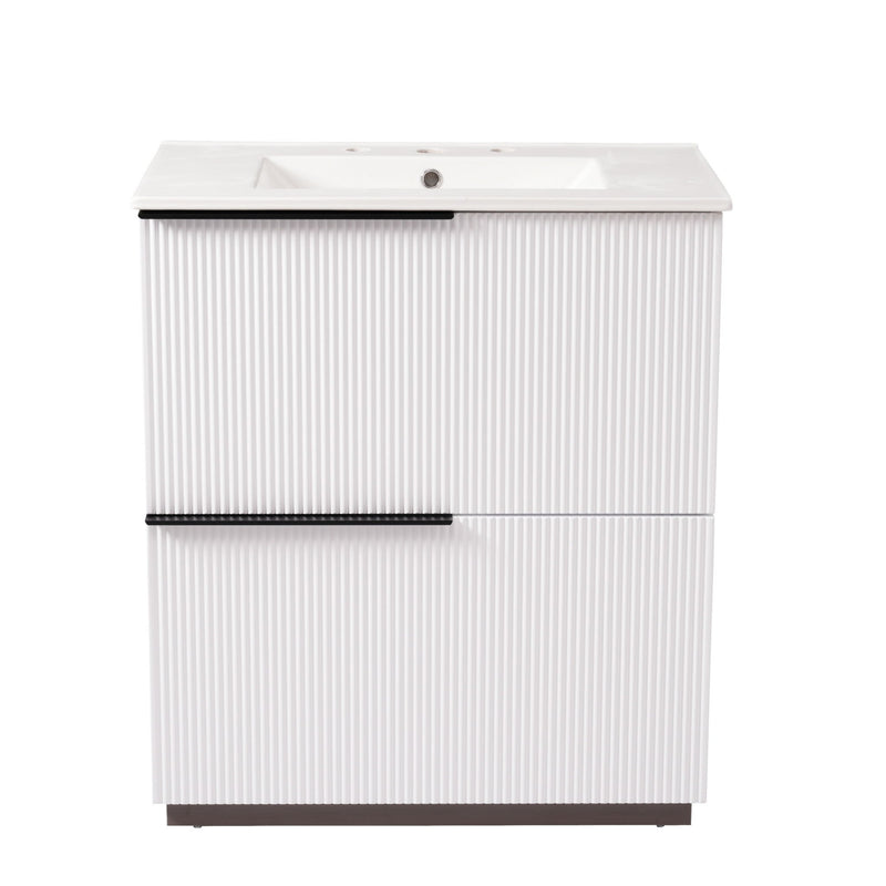 White fluted bathroom vanity with white ceramic sink and center handle bar