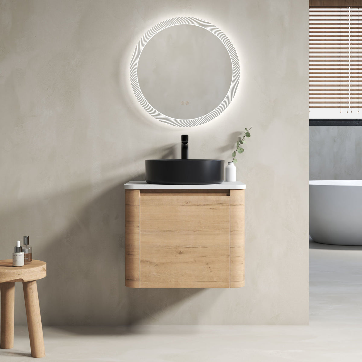 Wall-mounted bathroom vanity in light wood with white top and black round vessel sink
