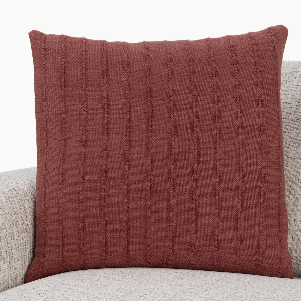 Hunter SLD pillow in cherrywood red on sofa, square front with vertical textured stripes