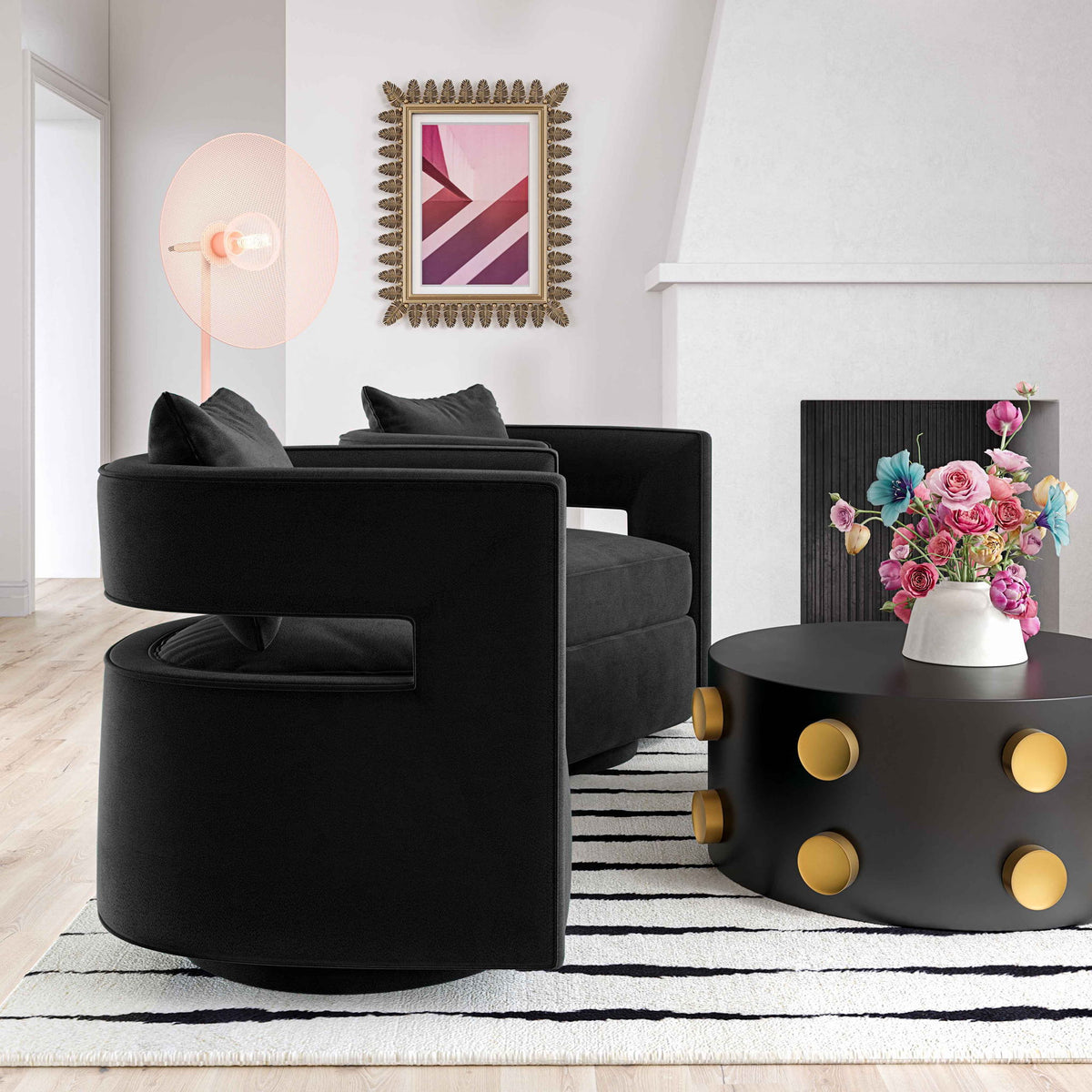 Black swivel accent chair with round seat, fabric upholstery, and back cushions
