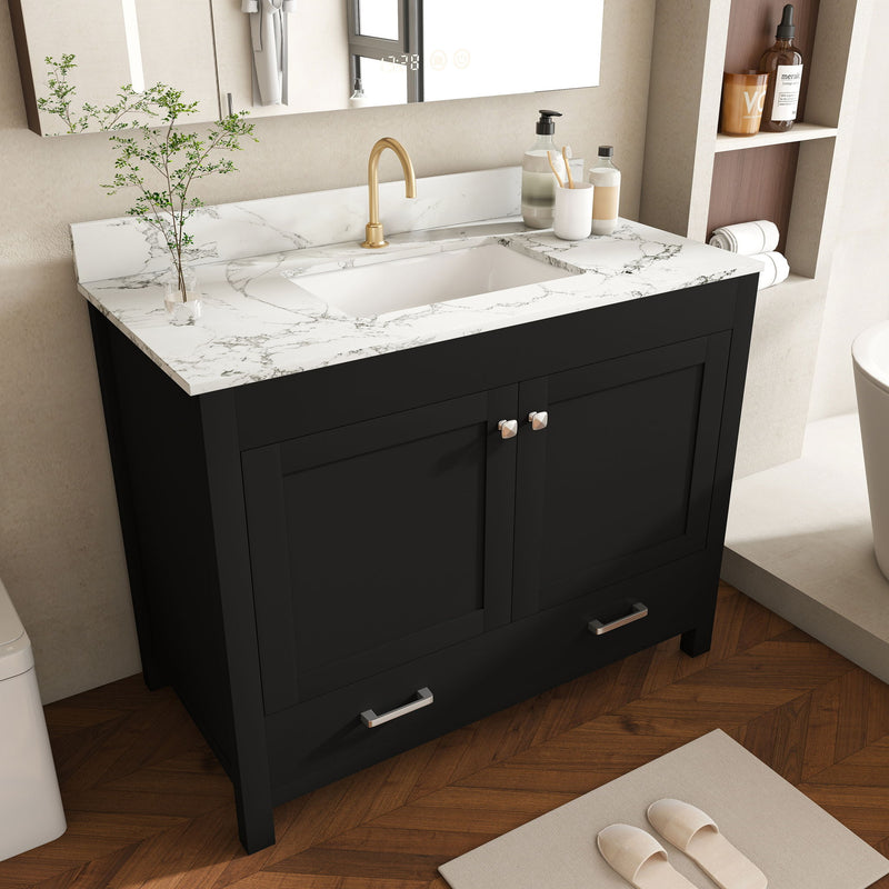 Black bathroom vanity set with marble-look top, sink, gold faucet, two doors and drawers