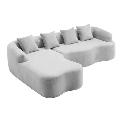 Gray modular L-shape sectional sofa with curved chaise and square back cushions