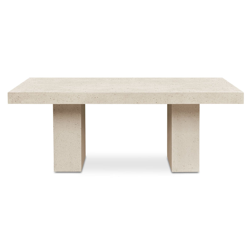 Rectangular outdoor dining table with light terrazzo surface and pedestal legs