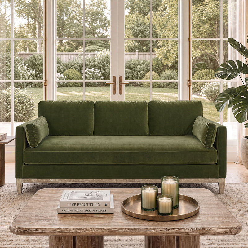 Knox modern farmhouse sofa in dark green, rolled arms, three seat cushions, wooden legs