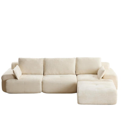 Beige sectional sofa with chaise, padded arms, and three back cushions