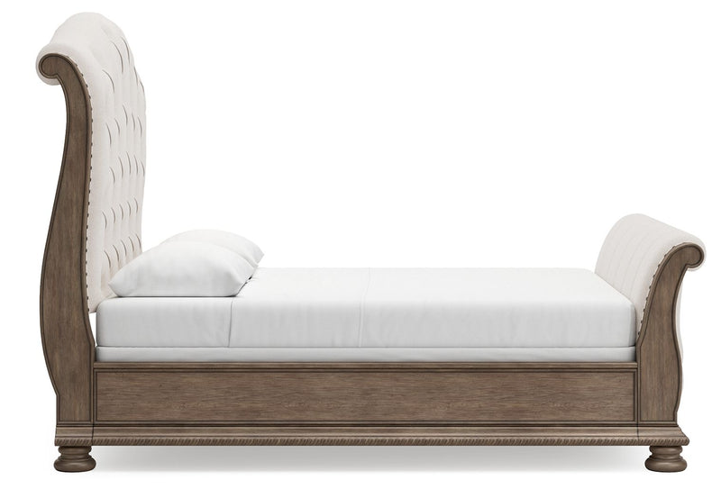 Cream upholstered sleigh daybed with light brown trim and tufted backrest
