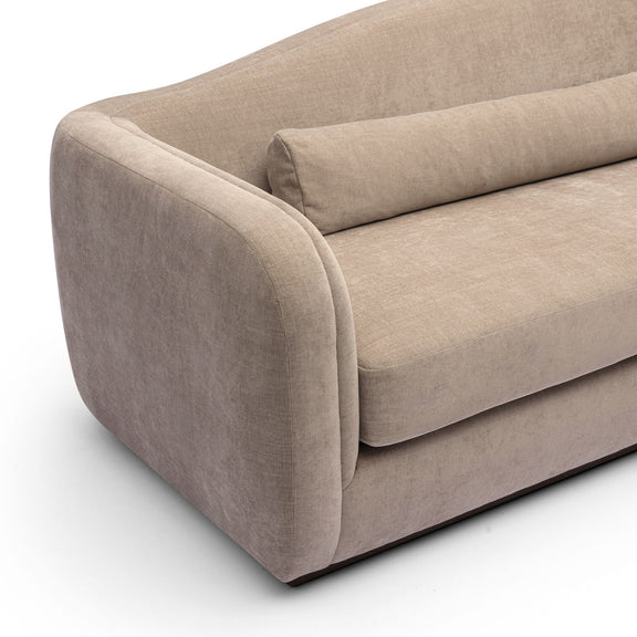 Light brown upholstered sofa with curved arms and large seat cushion