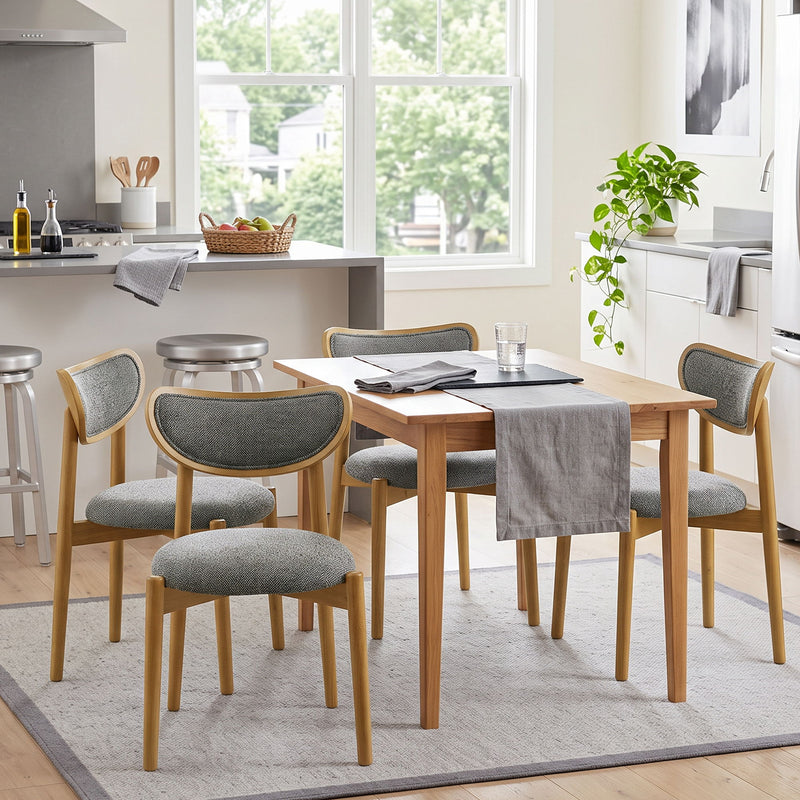 Dark gray upholstered dining chairs arranged around a wooden dining table