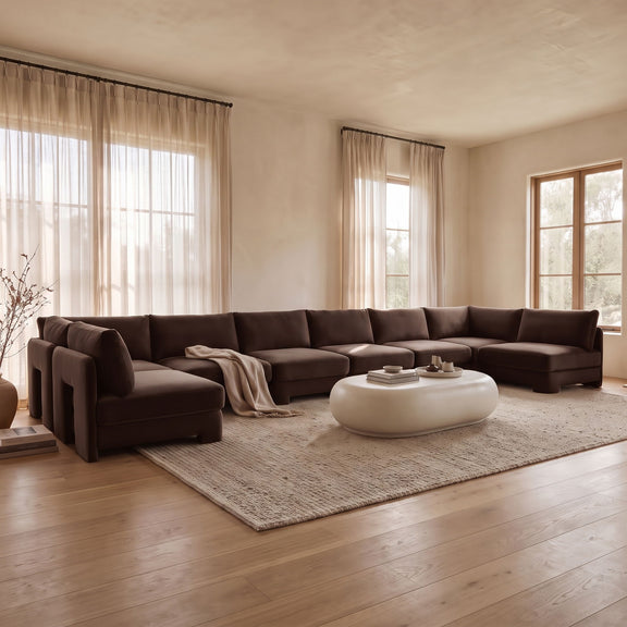 U-shaped armless sectional sofa with dark velvet cushions and modular chaise end