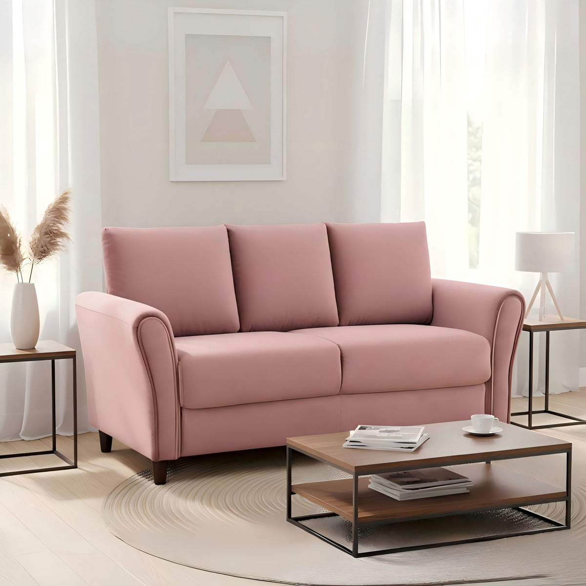 Pink 3-seat sofa with curved arms, three back cushions, and dark tapered legs.