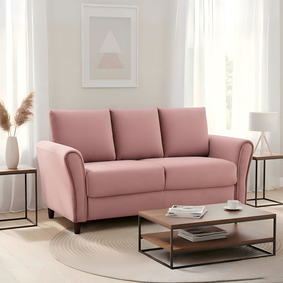 Pink 3-seat sofa with curved arms, three back cushions, and dark tapered legs.