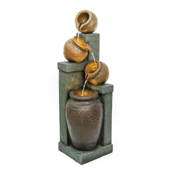 Four-tier outdoor fountain with textured brown vessels, green-gray stone-look frame, and flowing water.