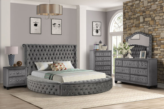Gray king bed with tufted headboard, matching nightstand, dresser and mirror