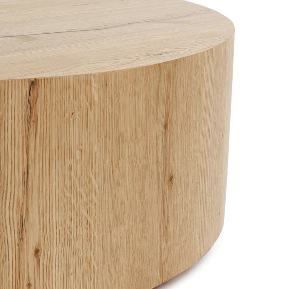 Round coffee table with natural light wood grain finish and curved side