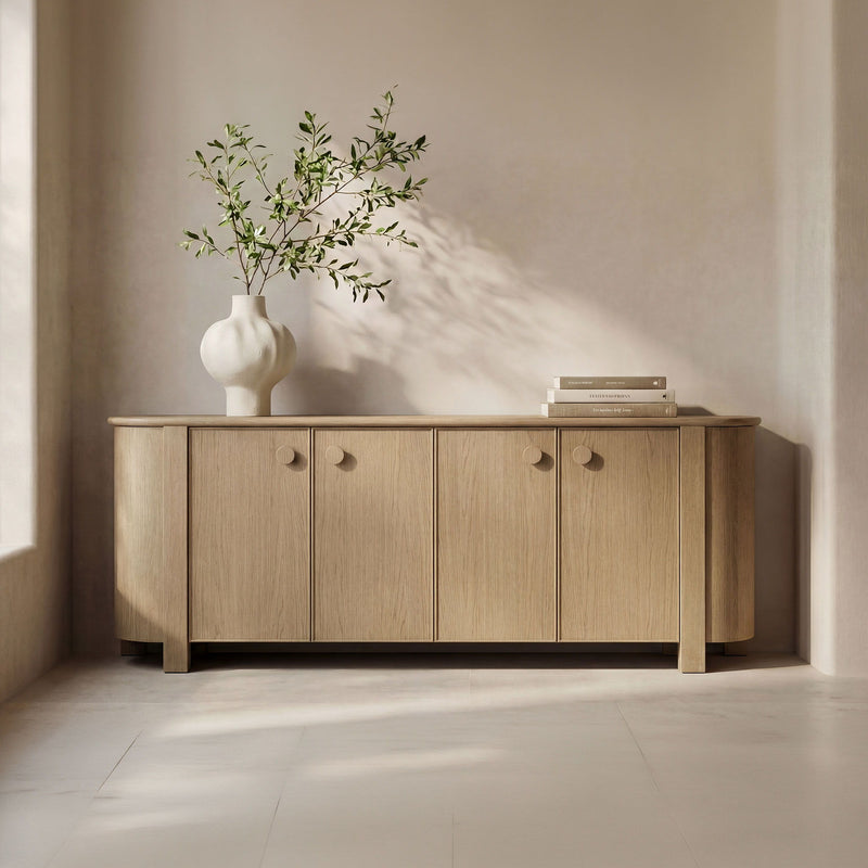 Natural wood sideboard with multiple doors and round knobs, tapered legs