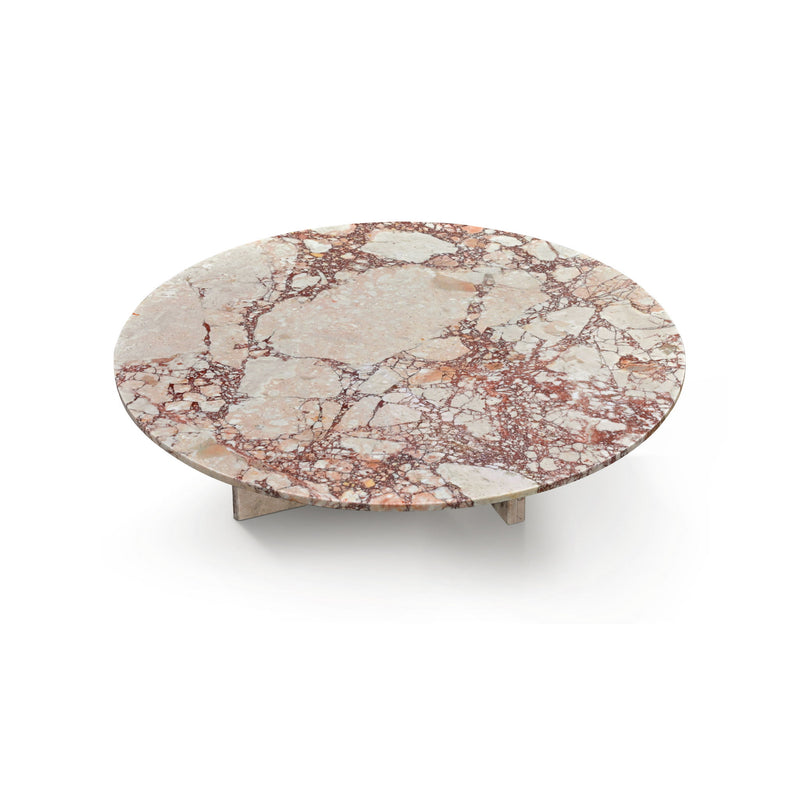 Round rose-pink marble coffee table with speckled veining and compact stone base