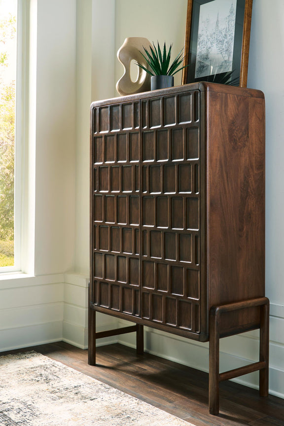 Brown accent cabinet with geometric square-panel door and angled side