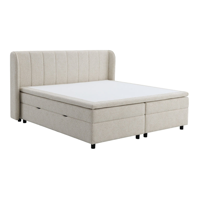 Beige upholstered storage bed with vertical channel headboard and mattress