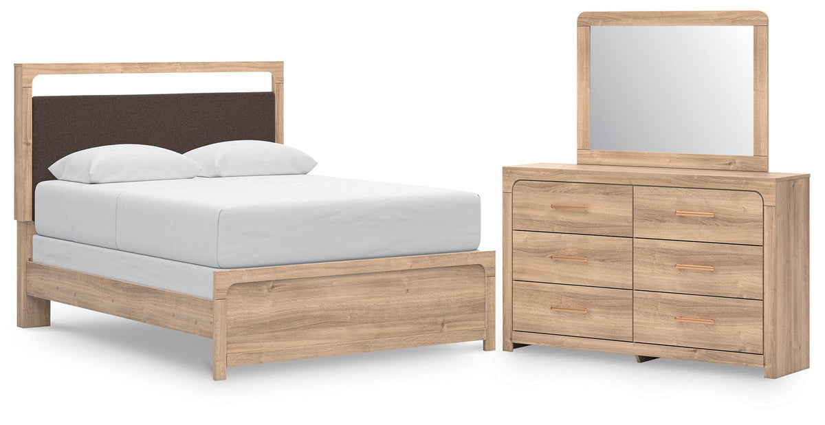 Queen upholstered panel bed with tan dresser and arched mirror set