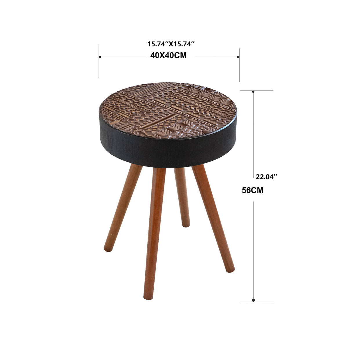 Round coffee table with carved patterned top, dark base, and three brown tapered legs