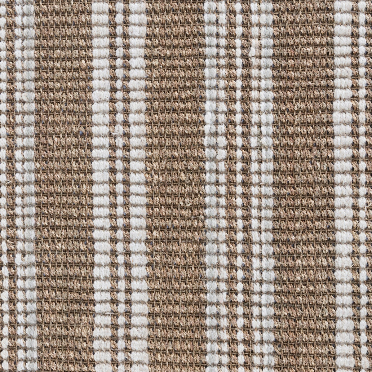 Close-up of tan and white vertical stripes in textured area rug weave.