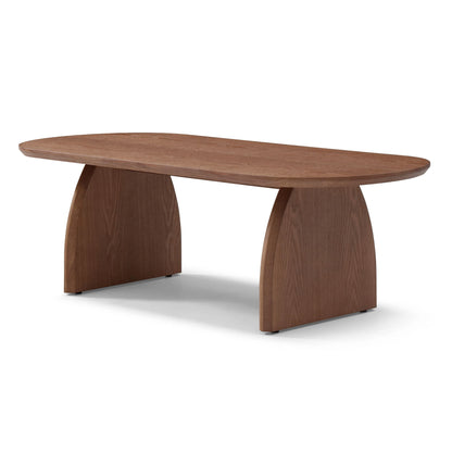 Oval coffee table with dark brown wood top and tapered pedestal legs