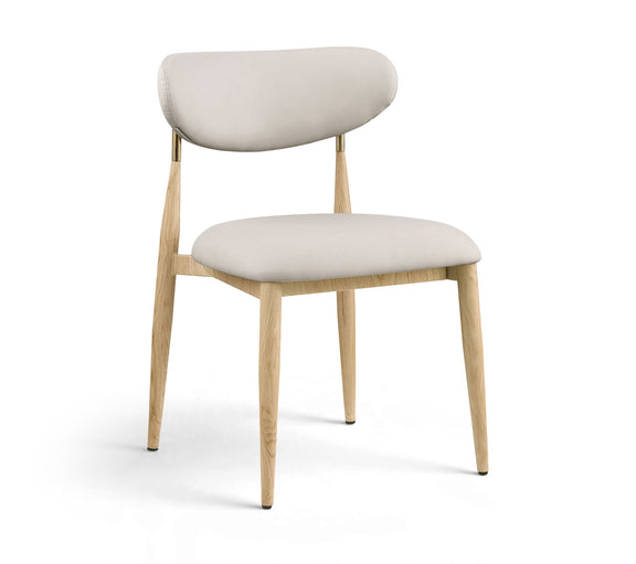 Light neutral upholstered dining side chair with light wood legs and brass accents