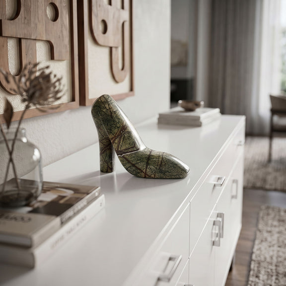 Green marbled marble high-heel shoe tabletop object displayed on a white surface