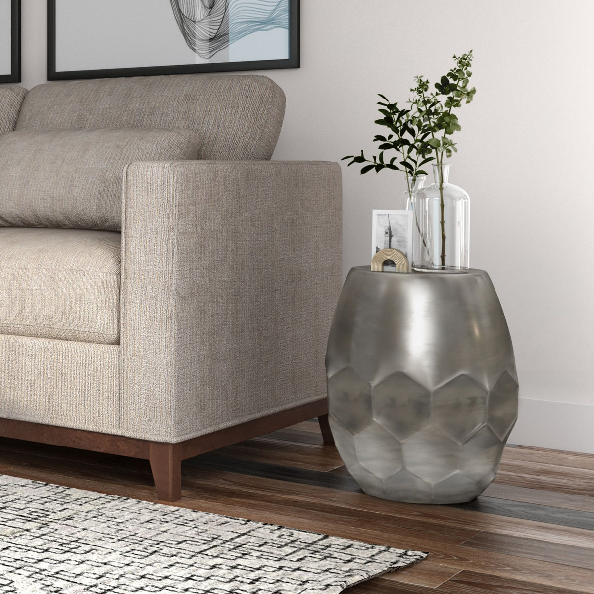 Silver round drum accent table with faceted diamond metal body and flat top