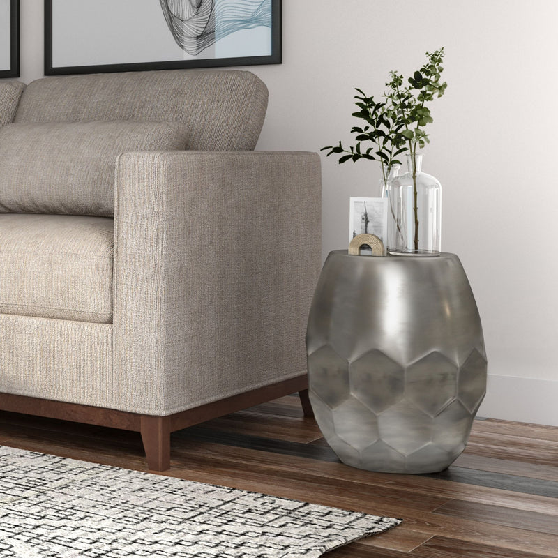 Silver round drum accent table with faceted diamond metal body and flat top