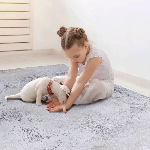 Light gray washable runner rug with distressed, speckled look across the surface