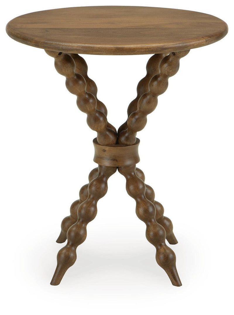 Light brown round accent table with carved trestle legs