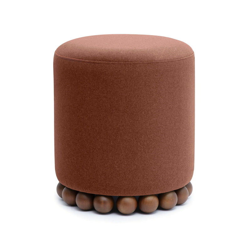 Dark brown round ottoman with plush fabric top and wooden ball base