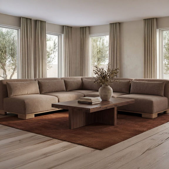 L-shaped sectional sofa with brown fabric upholstery and cushioned backrests