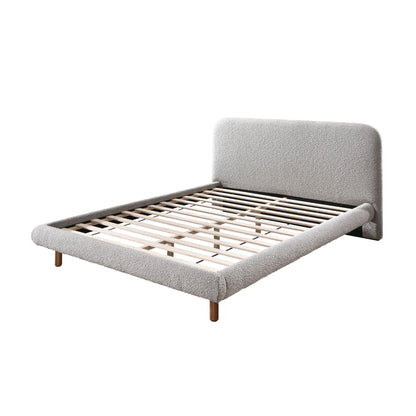Gray upholstered platform bed with curved headboard and slatted base, wooden legs