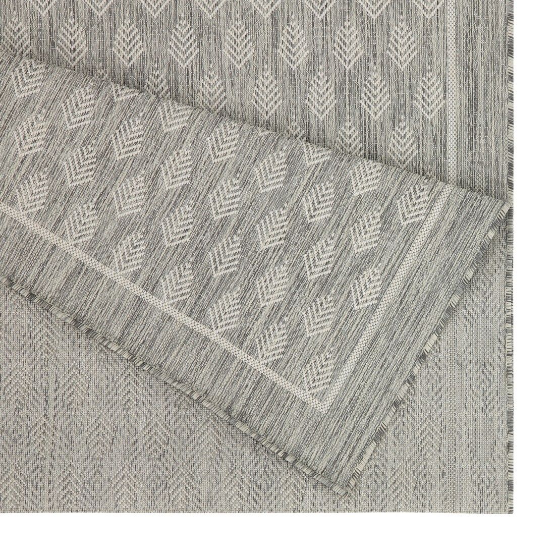 Light gray area rug with repeating diamond pattern and fringed trim edge