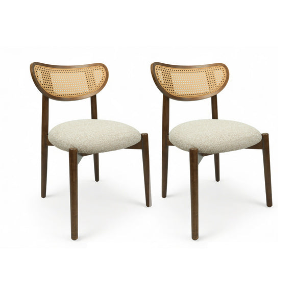Pair of rattan dining chairs with cream seats and dark wood frames