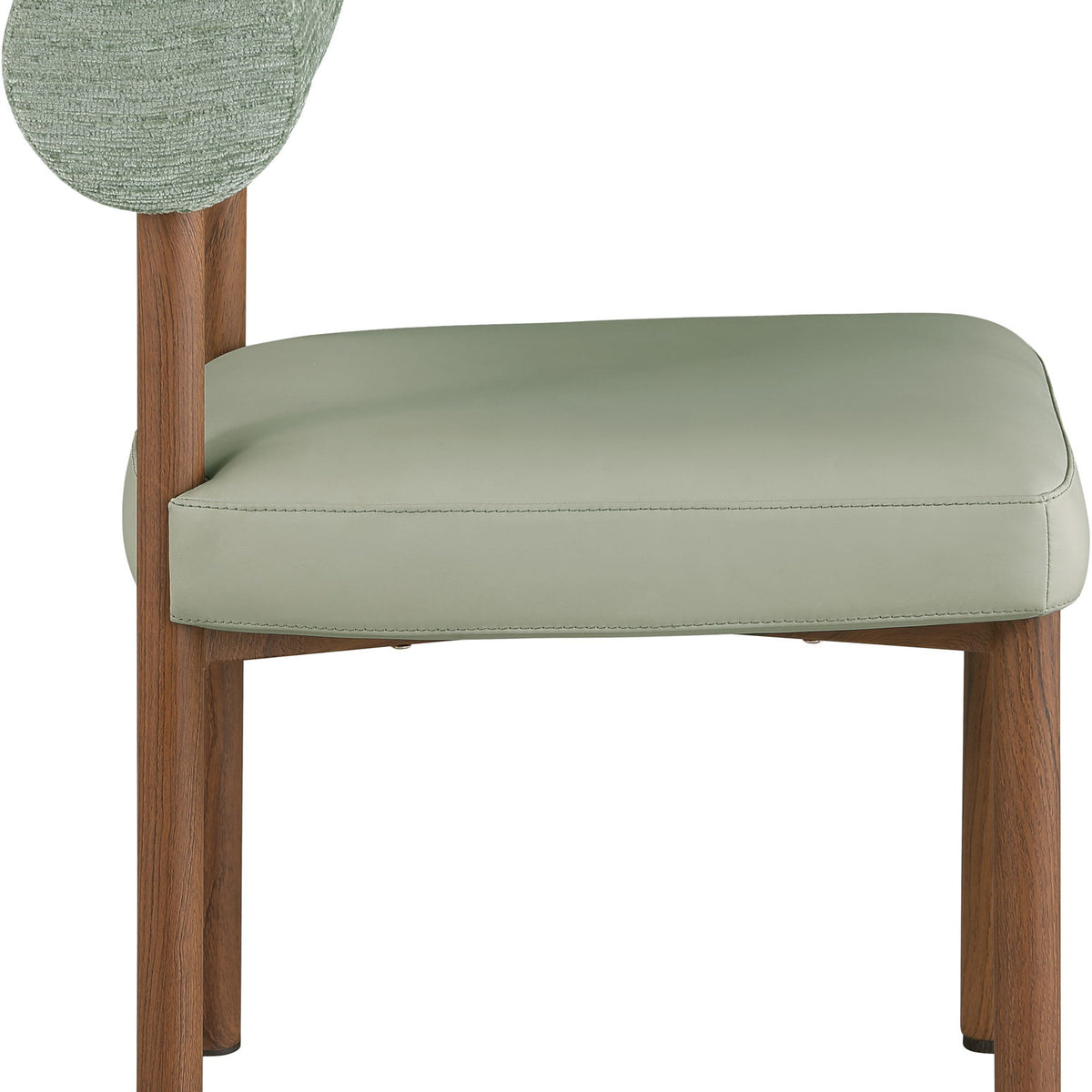 Upholstered dining chair with round fabric back, light green seat cushion, wood legs