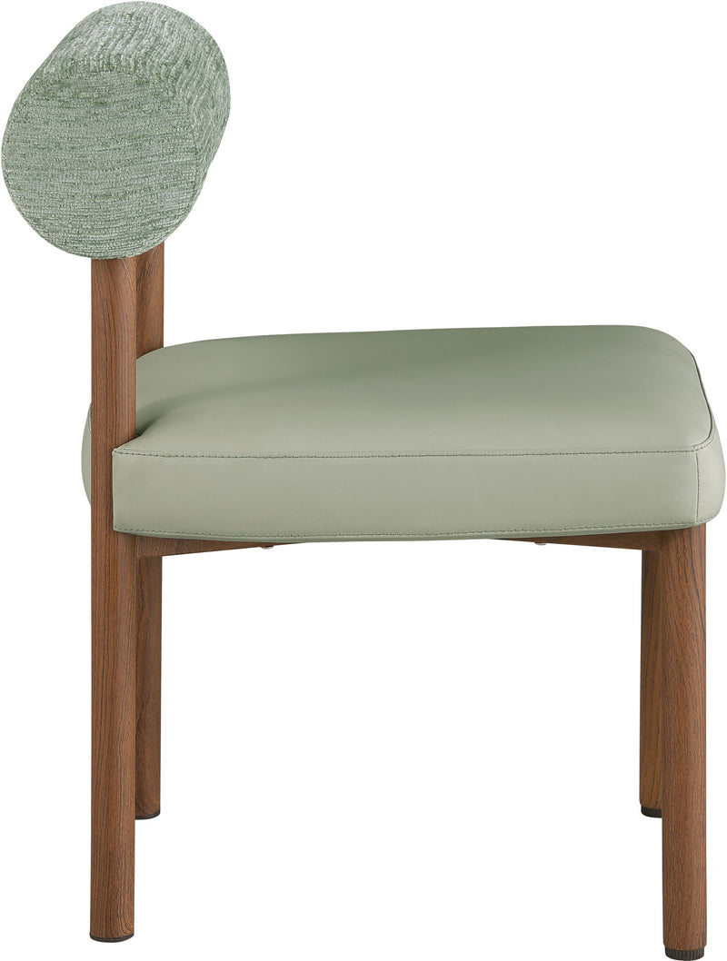 Upholstered dining chair with round fabric back, light green seat cushion, wood legs
