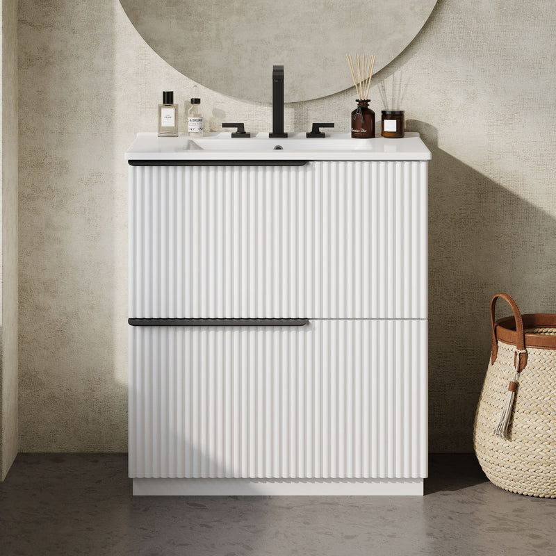 White fluted bathroom vanity with ceramic sink and two-door cabinet front view