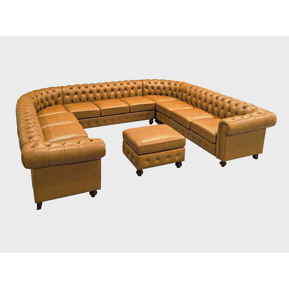 Light brown tufted U-shape sectional sofa with coordinating ottoman and square cushions