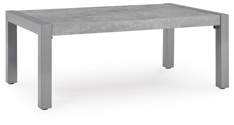 Gray rectangular table with concrete-look top and straight legs.