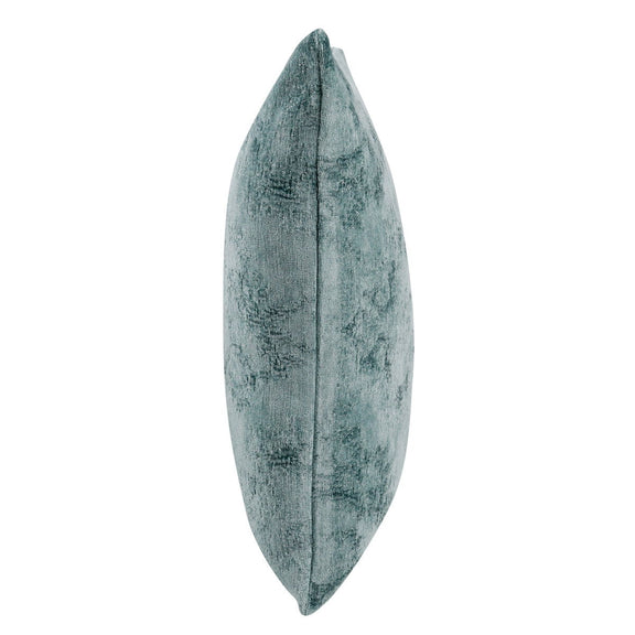 SLD decorative pillow in muted blue, narrow side view showing thickness