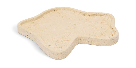 Beige travertine-style serving tray with irregular shape and shallow rim