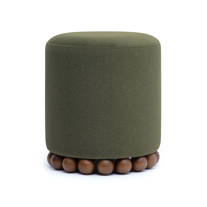 Round upholstered ottoman in dark green with beaded wooden base