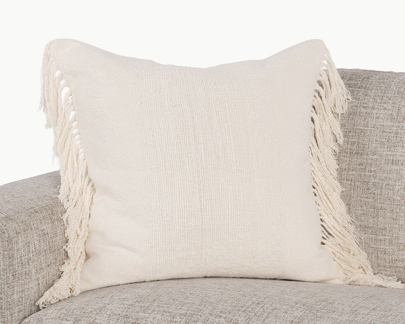 Ivory square pillow with woven texture and corner tassel fringe detail