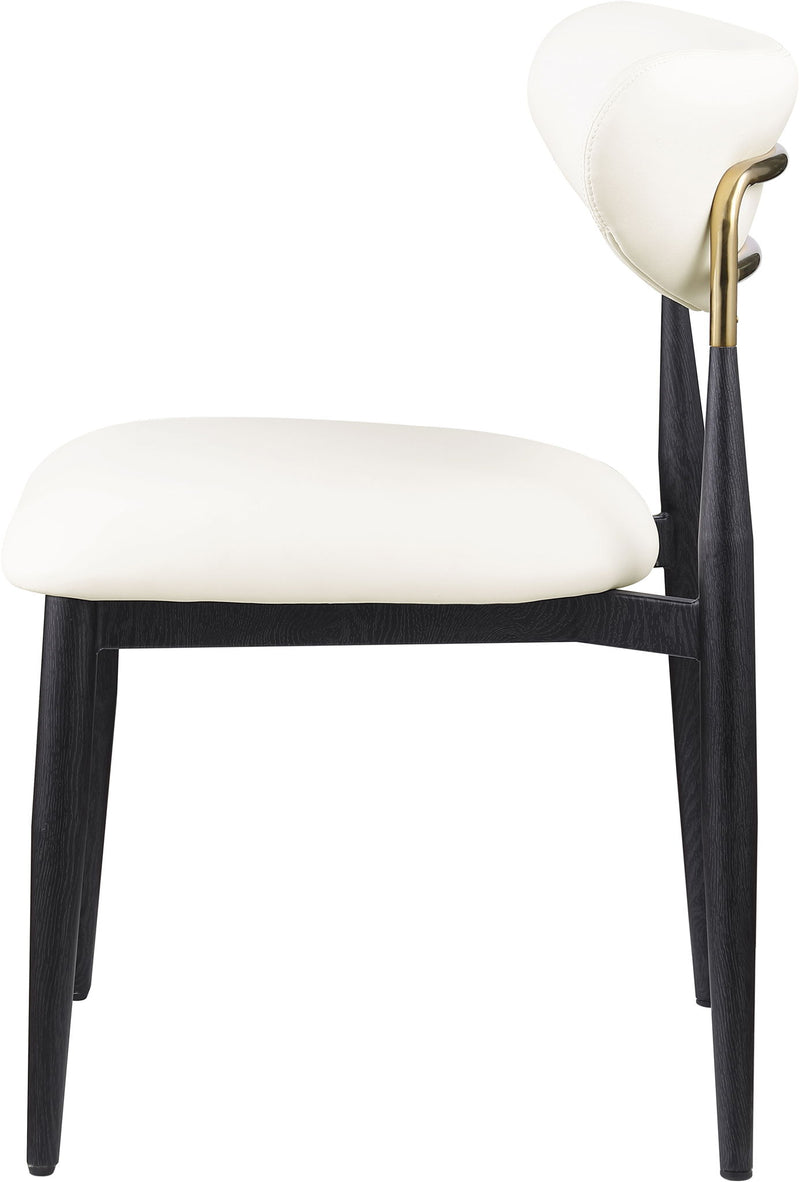 Dining side chair with white upholstered seat and rounded back, black legs