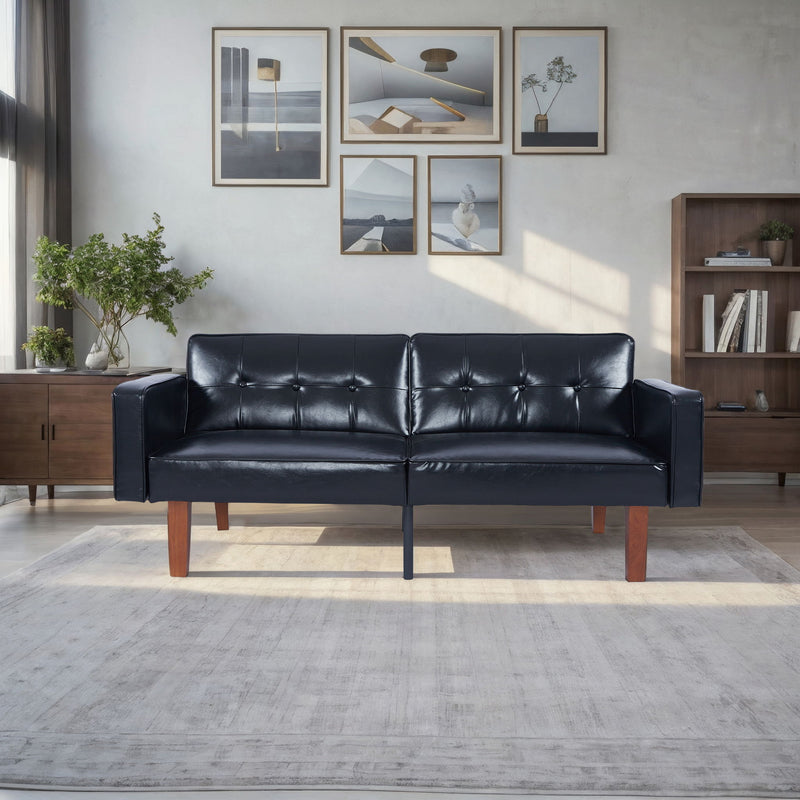 Black split-back futon sofa bed with tufted back cushions and dark wooden legs