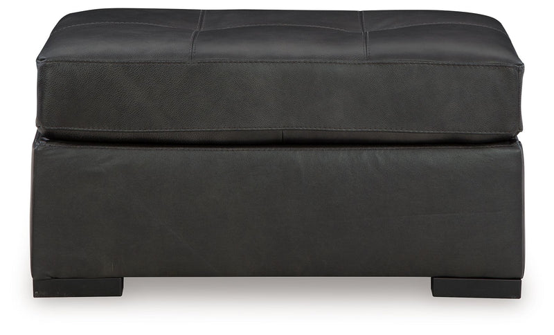 Oversized accent ottoman in dark gray with stitched lid and upholstered frame