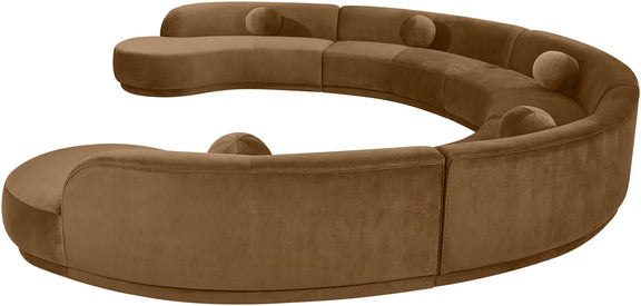 Brown velvet upholstered sectional sofa with curved armrests and tufted back pillows